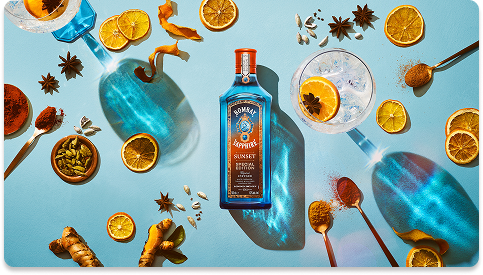Bombay Sapphire bottle surrounded by citrus, spices and the Bacardi logo
